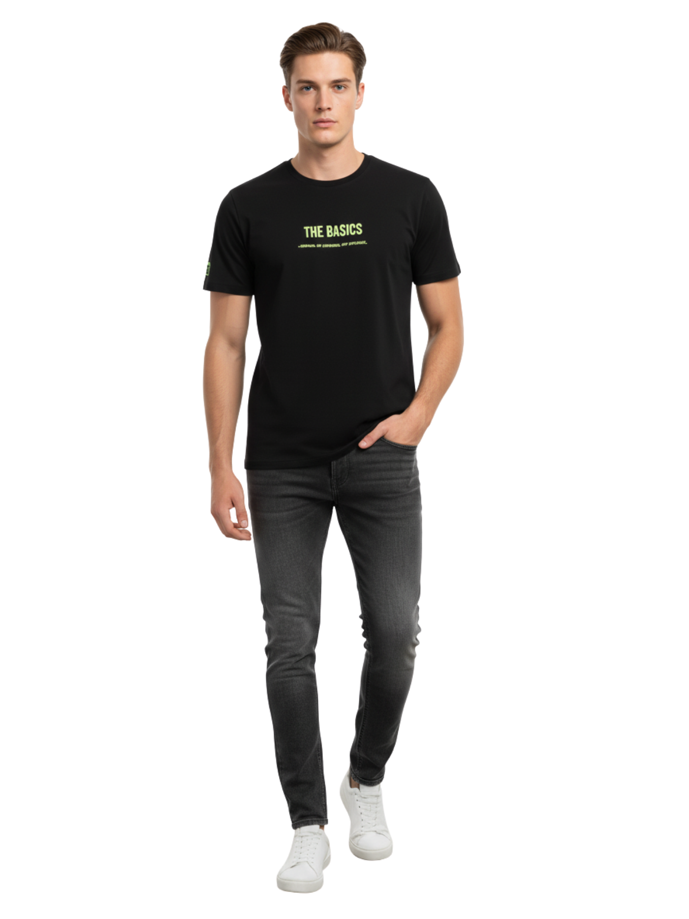 Man wearing a black t-shirt with 'THE BASICS' text and dark jeans on a white background